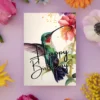 Printable birthday card with a green hummingbird and floral design, illustrated in watercolor style.