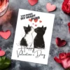 Whimsical Valentine's card with two cats sharing a kiss, saying "You Make My Heart Purr," ideal for feline fans.