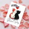Printable Valentine's Day card featuring two kissing cats with the text "You Make My Heart Purr."