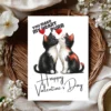 Two black and white kittens kiss on a Valentine card that says, "You Make My Heart Purr," celebrating love and affection.