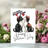Two black and white kittens kiss on a Valentine card that says, "You Make My Heart Purr."