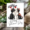 A Valentine card features two black and white kittens kissing, with the text, "You Make My Heart Purr."