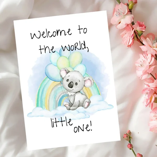Adorable printable card showing a koala on a cloud with balloons and a rainbow, featuring the message "Welcome to the world!"