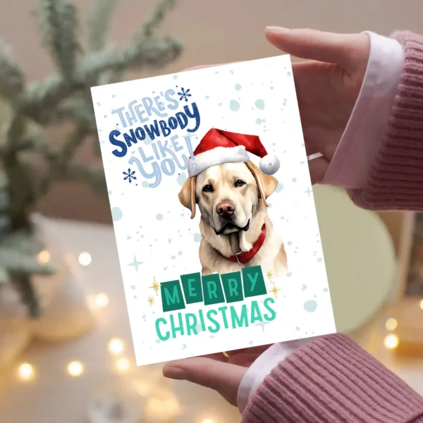 Holiday greeting card with Labrador retriever in winter scene