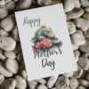 Printable Mother's Day card featuring a cheerful crocodile surrounded by colorful flowers.