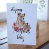 Printable card for Mother's Day showcasing a lioness and blooming flowers, celebrating the strength of mothers.