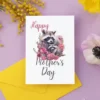 Cute raccoon surrounded by flowers on a printable Mother's Day card, perfect for celebrating moms with a touch of whimsy.