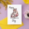 Playful tiger and baby image for a Mother's Day card, capturing the essence of maternal love and care.