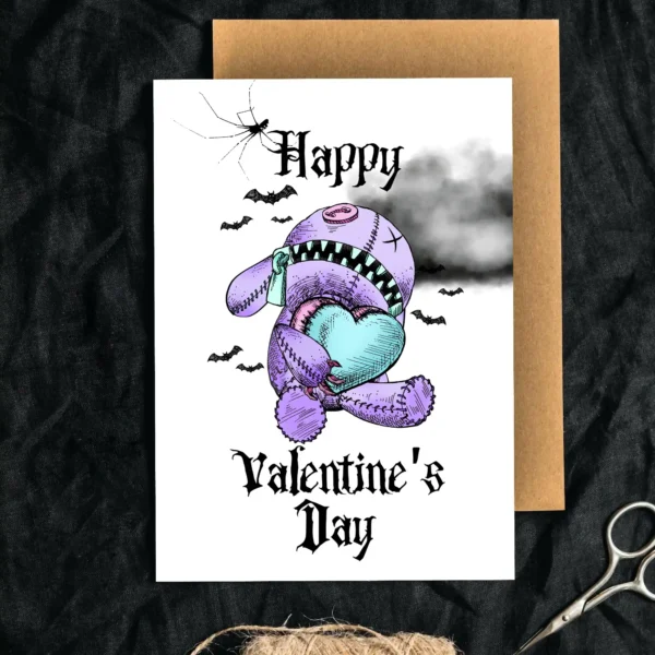 Valentine's Day card with a purple teddy bear, heart in hand, against a backdrop of dark clouds and bats.