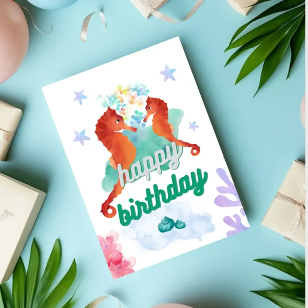 Underwater world birthday card with seahorses and sea life elements