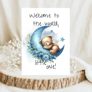 Watercolor card featuring a bear on a blue moon with the message, "Welcome to the world, little one!" for new babies.
