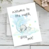 Watercolor card featuring a sleepy teddy bear on the moon with the message, "Welcome to the world, little one!"