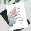 Sympathy card showcasing angel wings in watercolor, featuring the quote "Grief is just love with nowhere to go."