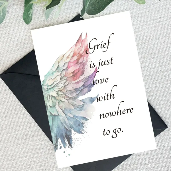 Sympathy card showcasing angel wings in watercolor, featuring the quote "Grief is just love with nowhere to go."