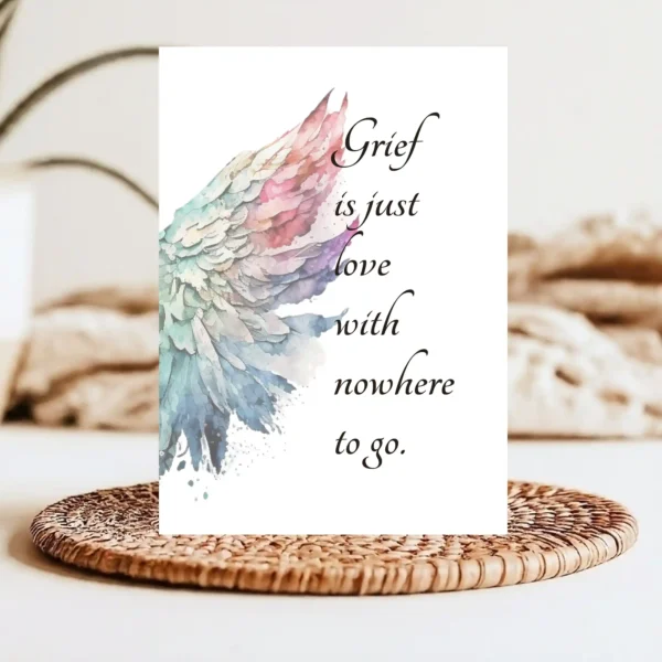 Card with watercolor angel wings and the comforting quote "Grief is just love with nowhere to go."