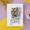Vibrant birthday card with a majestic tiger portrait, conveying joy and celebration for a birthday occasion.