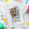 Printable card with a majestic tiger portrait, wishing a joyful "Happy Birthday" in a fun and friendly style.