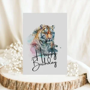 Cheerful tiger watercolor birthday card with a pastel background, ideal for sending warm wishes on someone's special day.