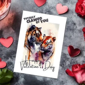 Cute printable Valentine's Day card with a tiger couple, saying "Totally clawed by you" in a colorful watercolor design.