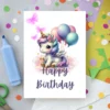Unicorn birthday card with balloons and butterflies