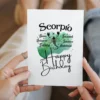 Scorpio-themed birthday card featuring traits, adorned with a green watercolor background representing the water element.