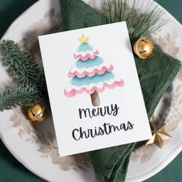 Cheerful transgender Christmas card showcasing a pink and blue watercolor tree, perfect for celebrating diversity this holiday season.