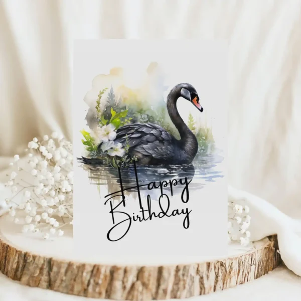 Watercolor birthday card featuring a black swan in a natural setting with a cheerful "Happy Birthday" message.