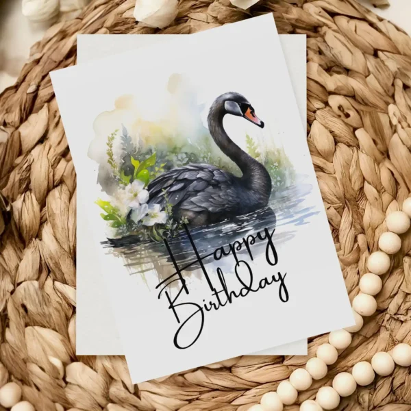 Delightful birthday card with a black swan watercolor image in a natural backdrop, highlighting a cheerful "Happy Birthday" note.