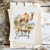 Happy birthday card with a watercolor camel in a scenic background, featuring a joyful "Happy Birthday" greeting.