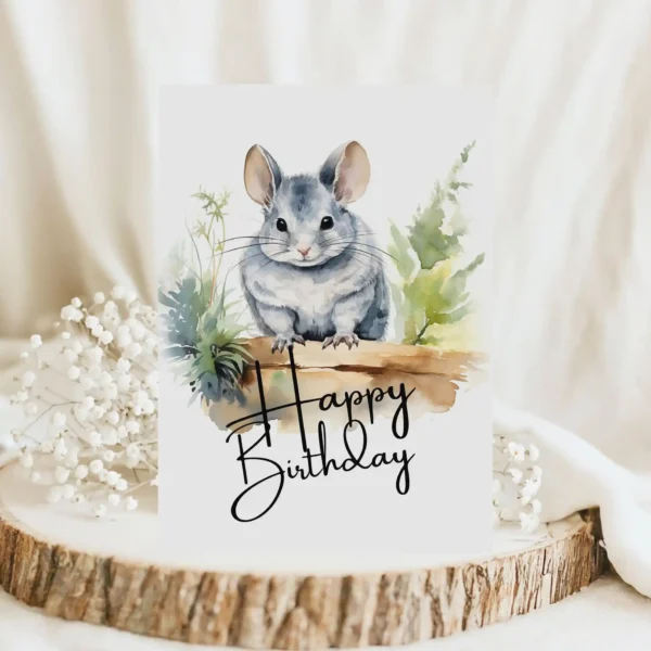 Printable birthday card showcasing a happy chinchilla in a watercolor scene, adorned with a "Happy Birthday" message.