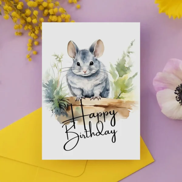 Charming watercolor birthday card of a chinchilla in a natural environment, celebrating with a "Happy Birthday" note.