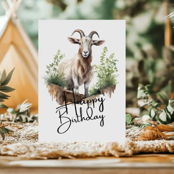 Printable birthday card with a joyful goat watercolor design, set in nature, and a "Happy Birthday" greeting.