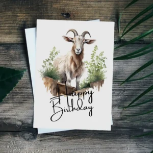 Happy birthday goat card featuring a watercolor illustration of a goat in a serene natural environment.
