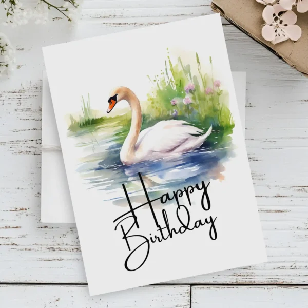 Happy birthday card showcasing a white swan in watercolor, set in nature, with a vibrant "Happy Birthday" text.