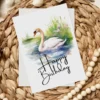 Charming birthday card with a watercolor swan in a natural backdrop, highlighted by a cheerful "Happy Birthday" note.