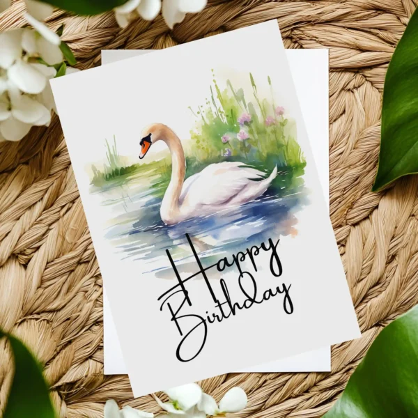 Watercolor illustration of a swan on a birthday card, surrounded by nature, featuring a festive "Happy Birthday" message.
