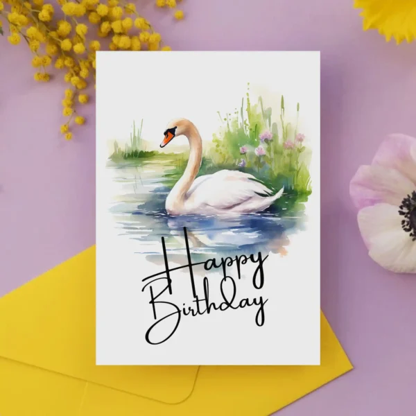 Printable birthday card with a watercolor swan in a serene setting, adorned with a joyful "Happy Birthday" greeting.