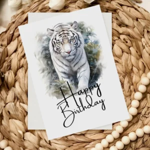 Happy birthday card showcasing a white tiger in a natural setting, illustrated in watercolor style.