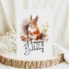 Watercolor birthday card featuring a cheerful squirrel in a natural setting with a "Happy Birthday" message.