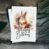 Happy birthday card with a joyful squirrel illustration in a winter scene, featuring a "Happy Birthday" greeting.