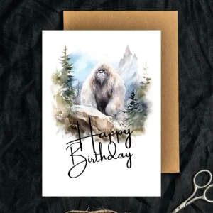 Printable Yeti birthday card featuring a watercolor design in nature, adorned with a joyful "Happy Birthday" greeting.
