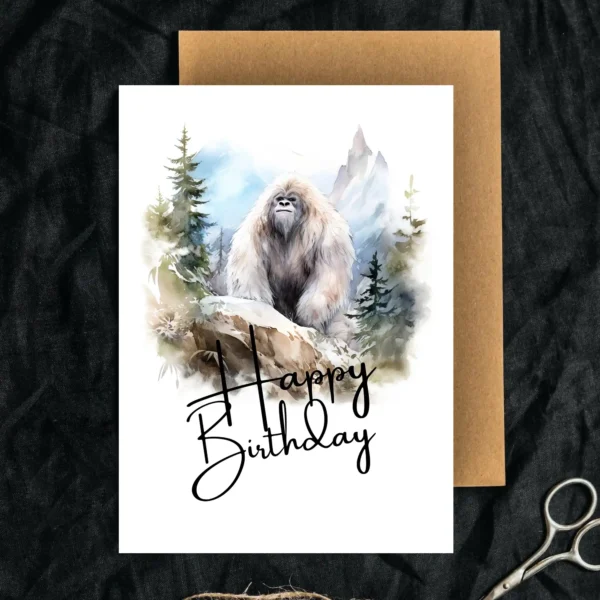Printable Yeti birthday card featuring a watercolor design in nature, adorned with a joyful "Happy Birthday" greeting.