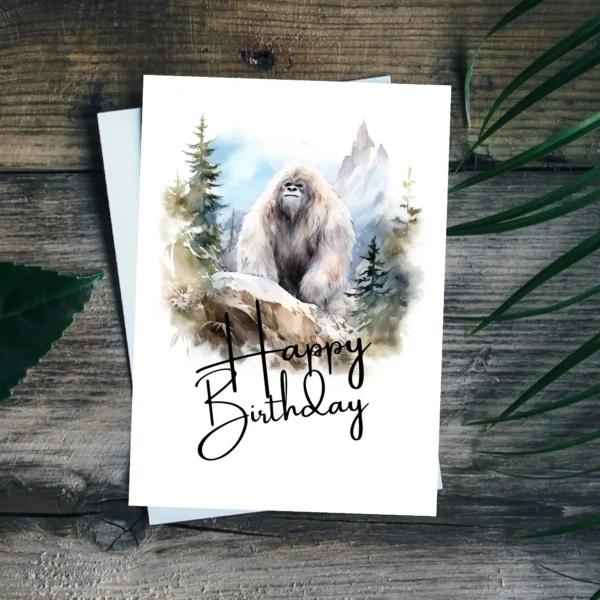 Charming Yeti birthday card illustrated in watercolor, set in nature, with a vibrant "Happy Birthday" message.