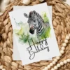 Watercolor birthday card showcasing a zebra in a natural environment, adorned with a festive "Happy Birthday" message.